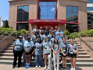 Group pic of summer attendees in Ole Miss shirts