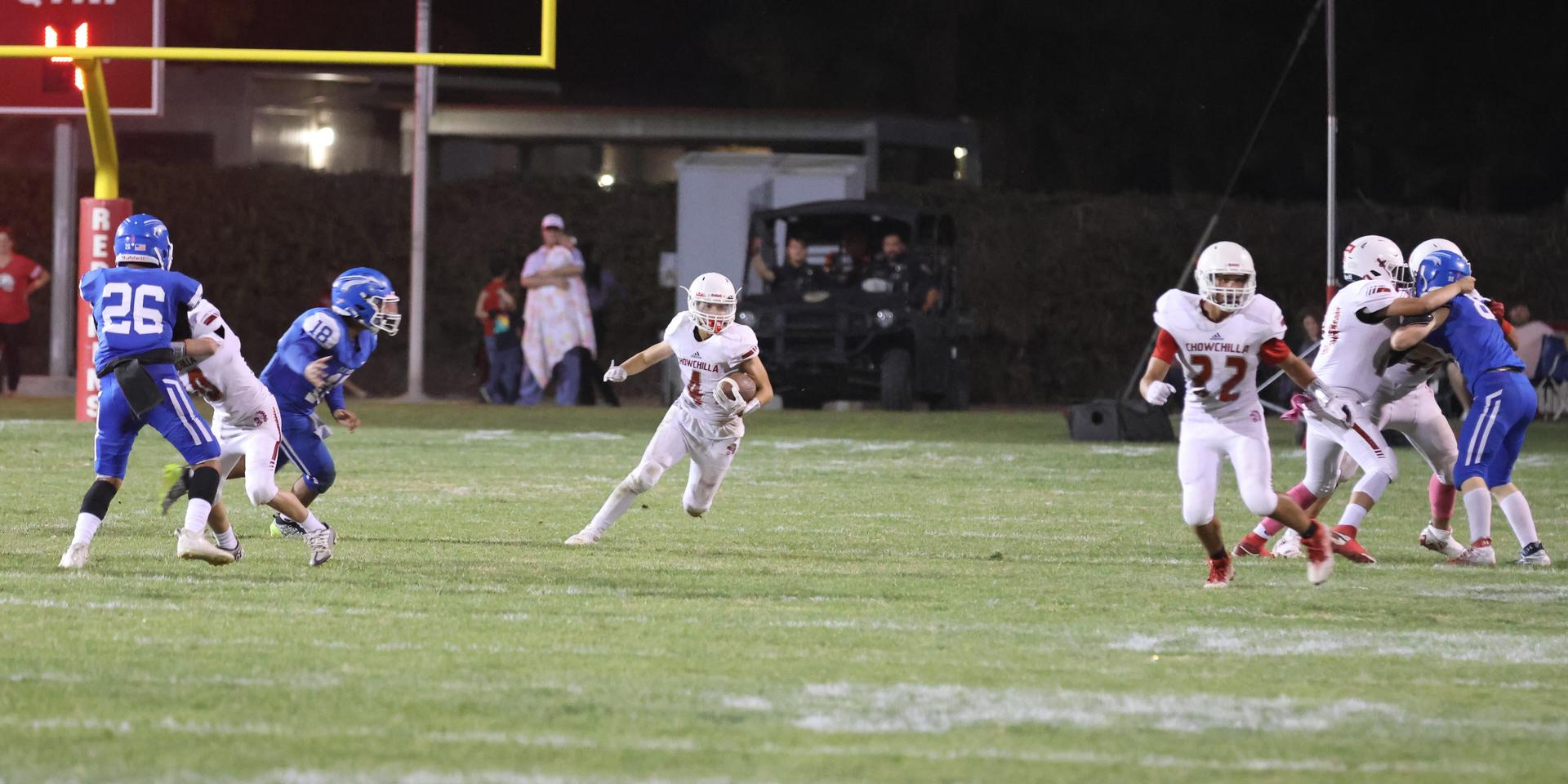 Junior Varsity football players in action against Caruthers