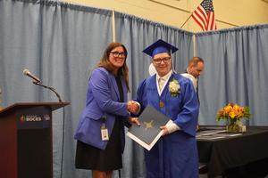 Principal shaking student's hand