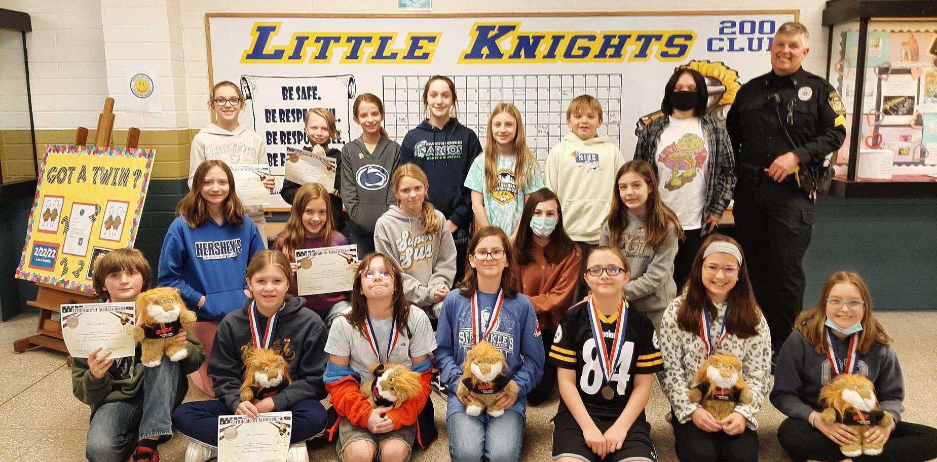 Essay winners with their prizes