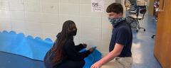 Students working on Christmas door decorations