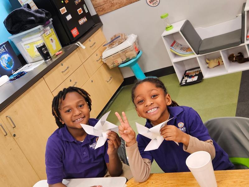 Two scholars with windmill projects