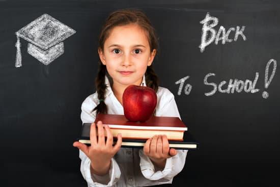 girl holding books, going back to school