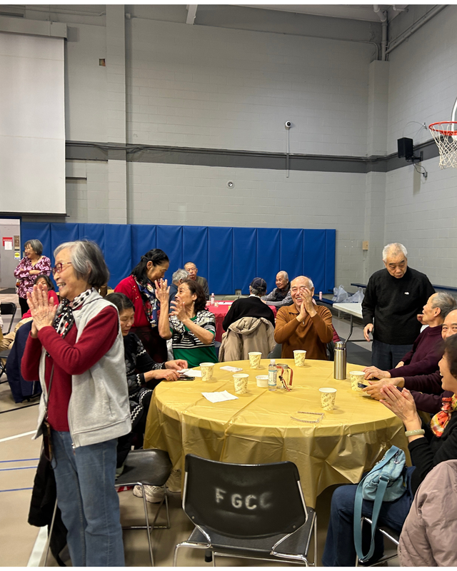 Senior center members applaud the concert