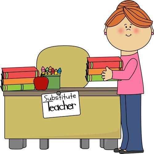 teacher standing at desk