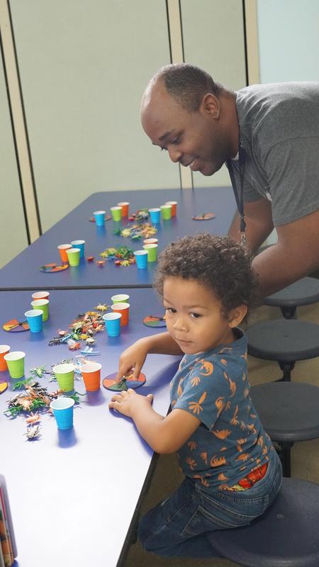 Dad and child engaging in play
