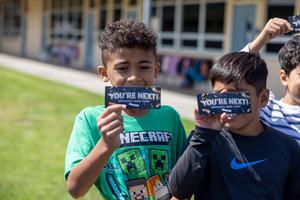 Students displaying the future tickets.