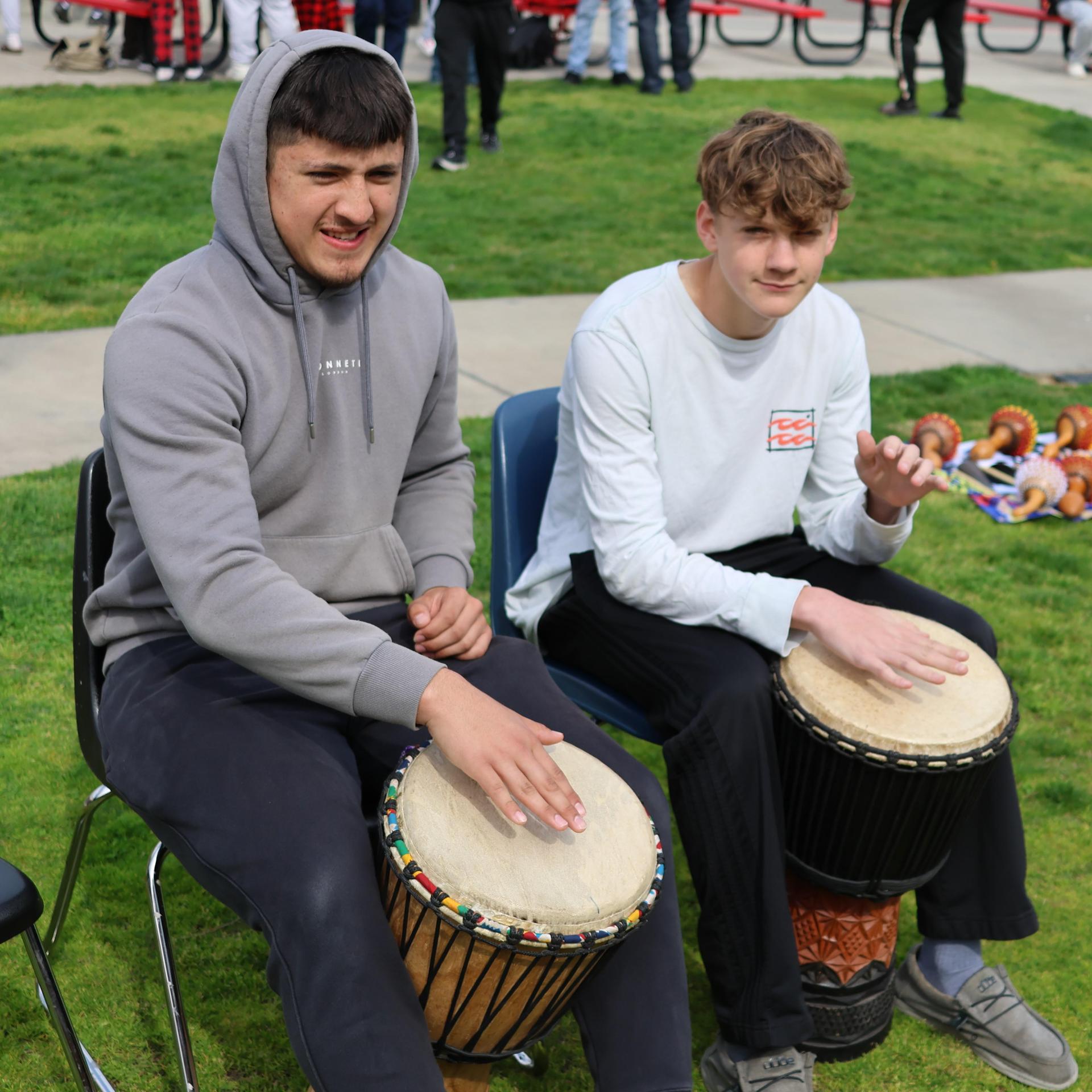 students and staff participating with the African Drum Interactive
