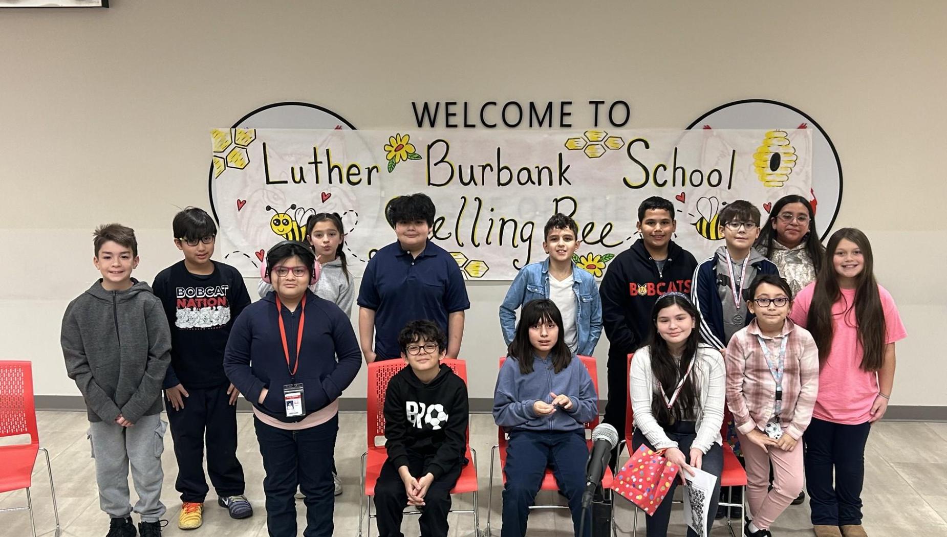 Students and a teacher gathered for the Luther Burbank School spelling bee event.