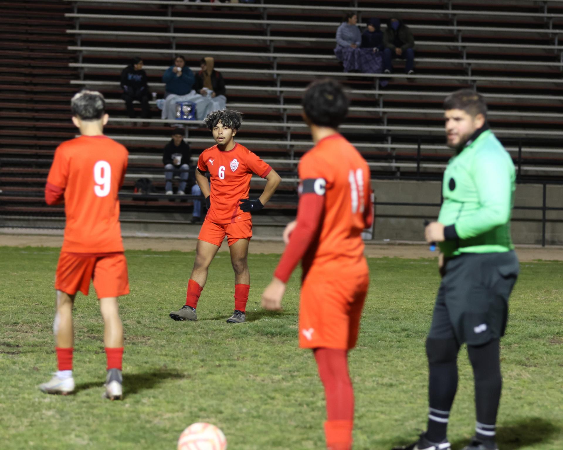 varisty boys soccer playing against yosemite