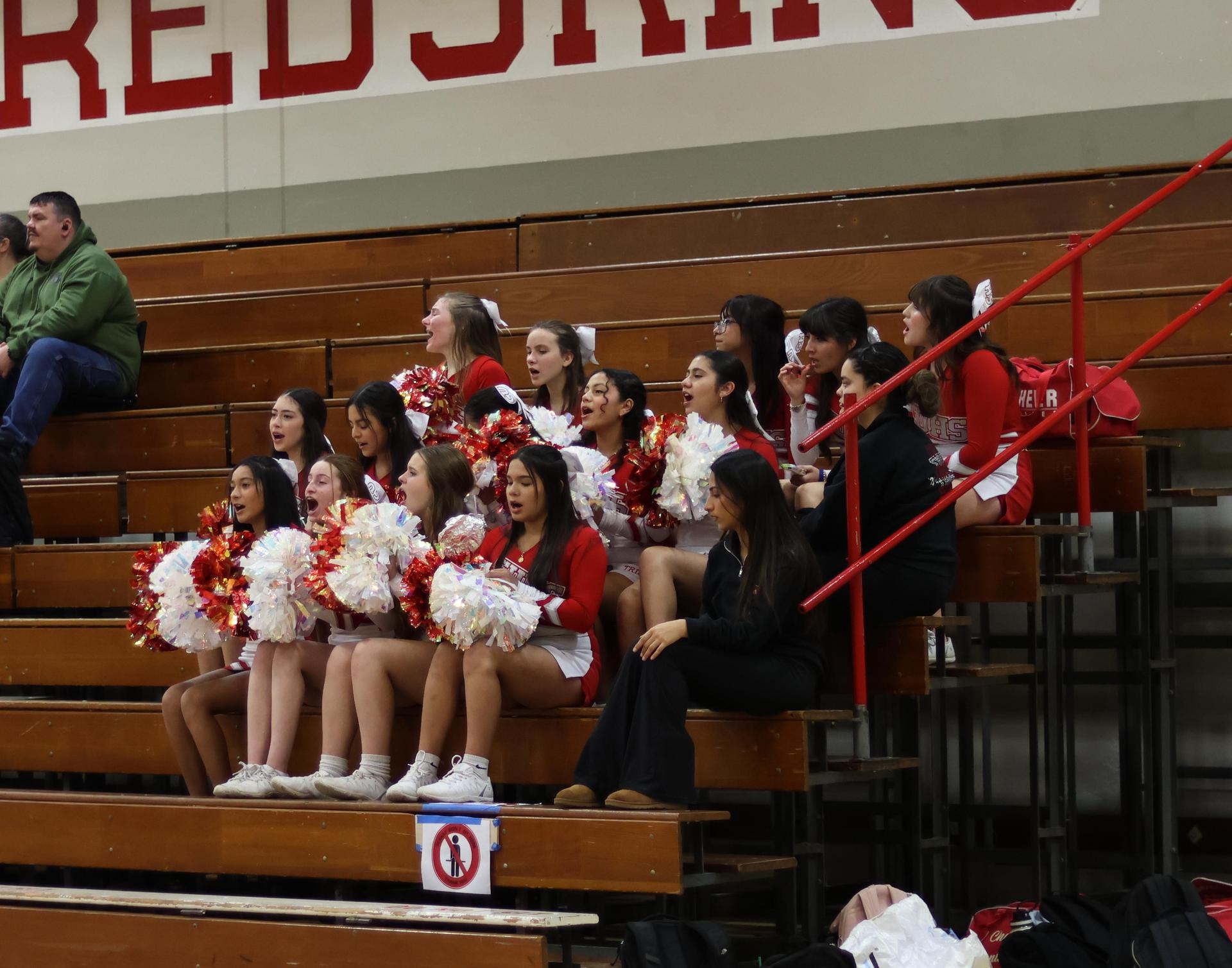 junior varsity cheerleaders cheering