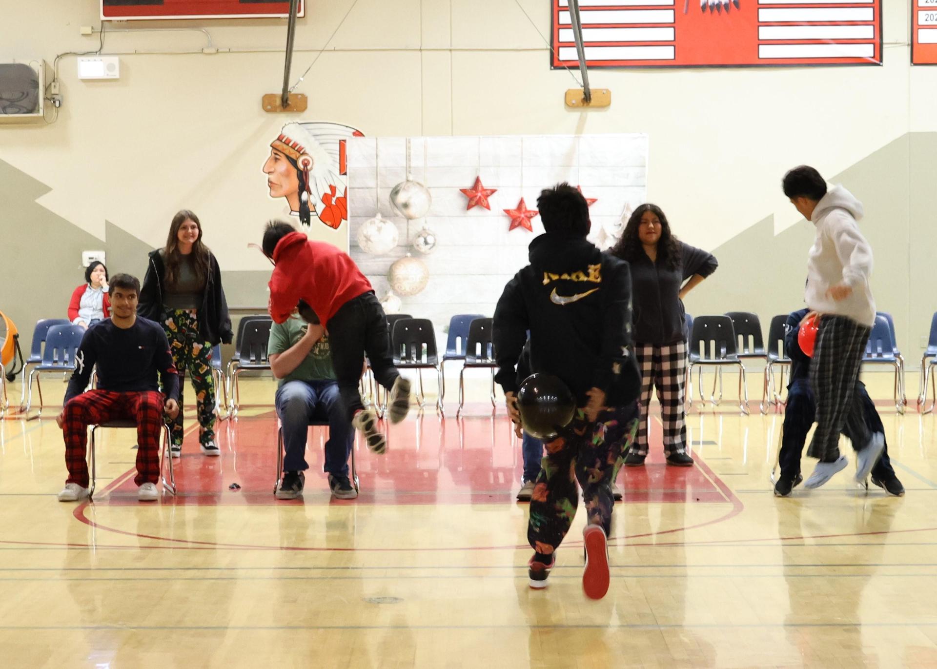 students playing the balloon pop game