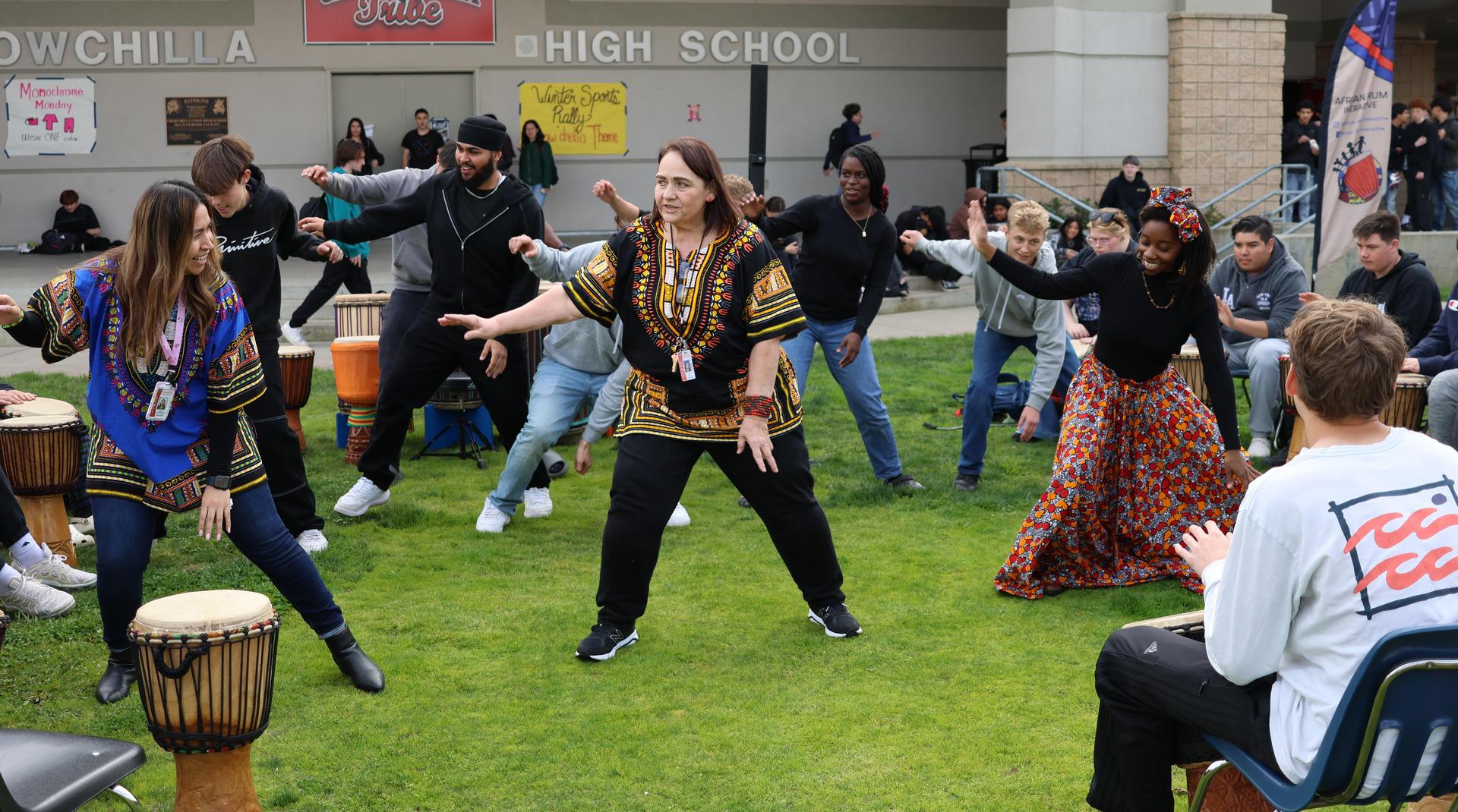 students and staff participating with the African Drum Interactive