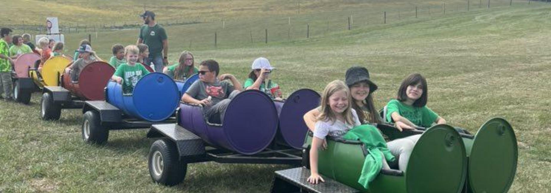 Students riding the train at Richdale Farm fieldtrip