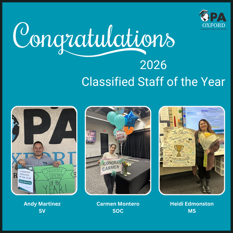 the three winners holding signs