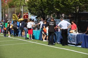 Families talking together at various tables.