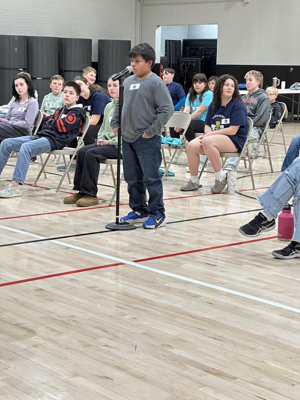 Students competing at spelling bee