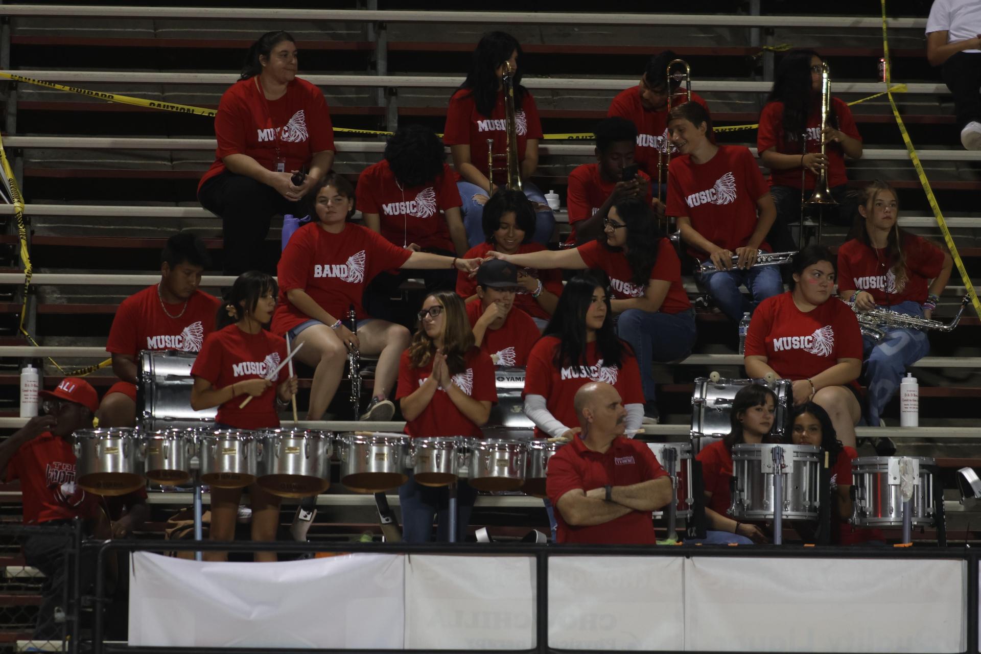 Students and community members enjoying the football game.