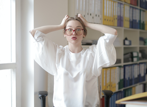 woman scratching head, confused