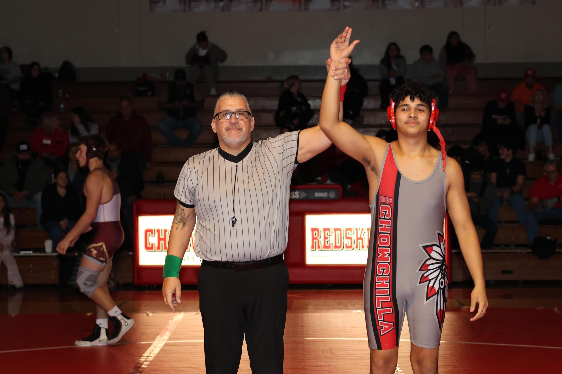 Wrestling winners with hands up 39
