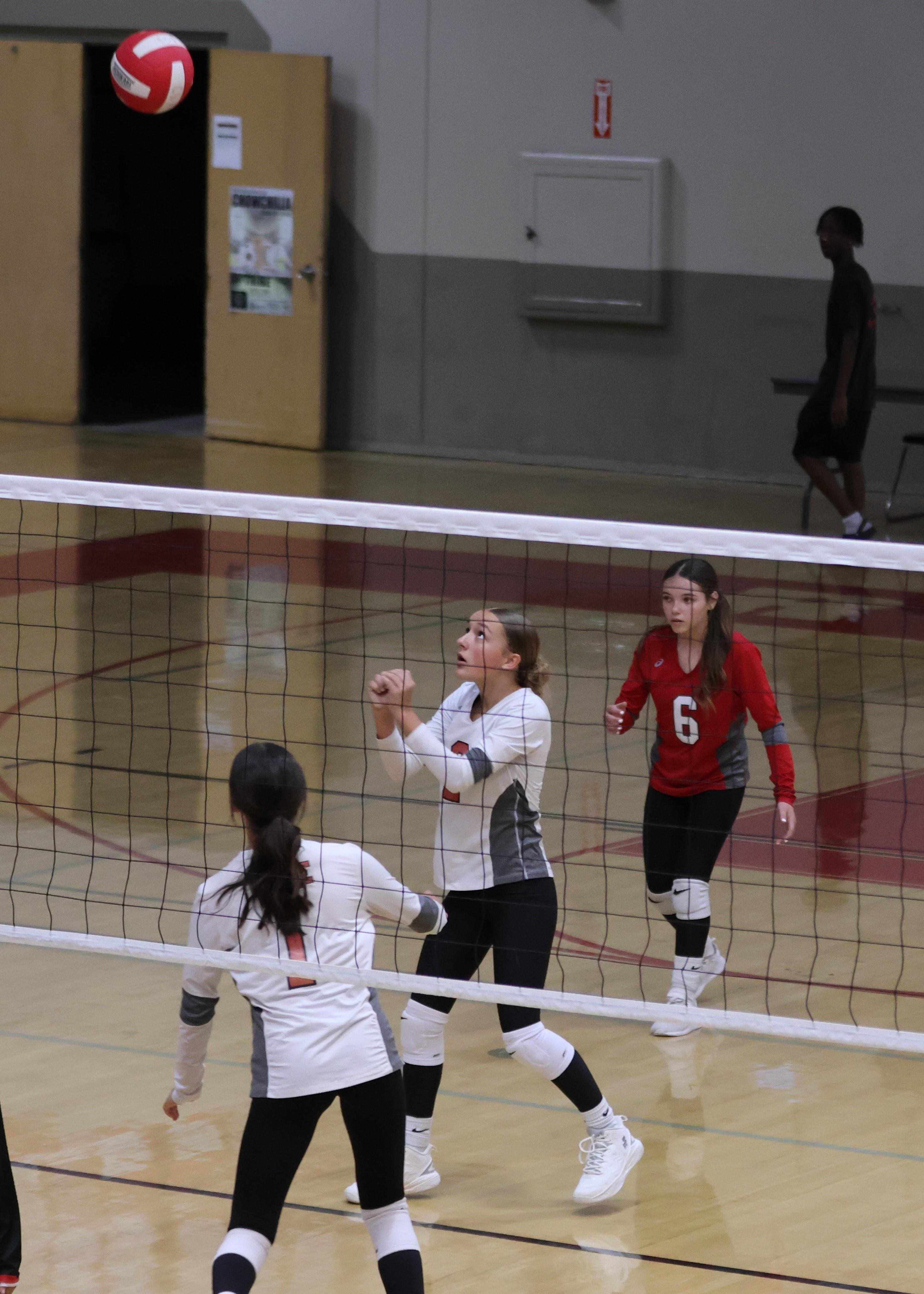 junior varsity girls playing volleyball 71