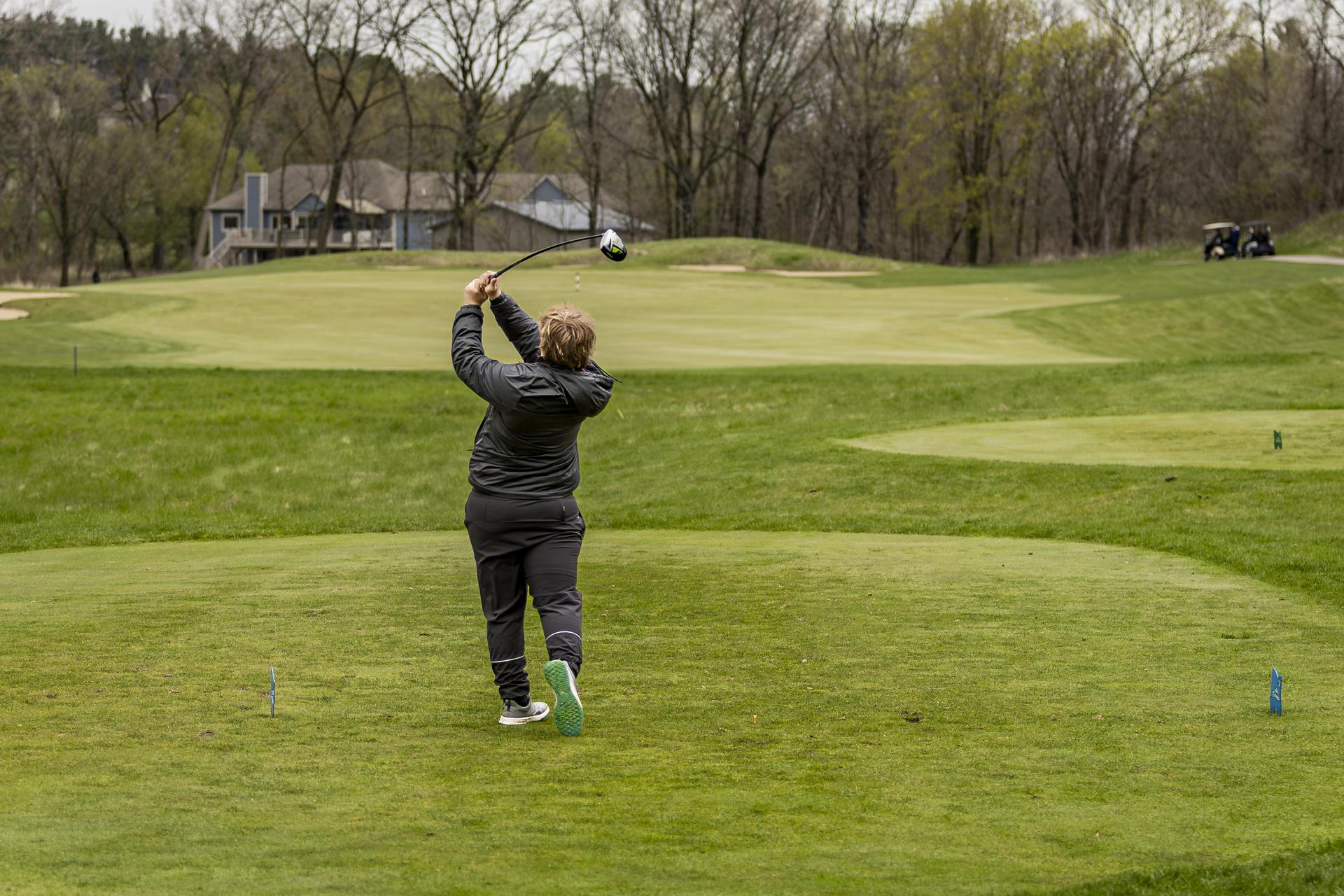 Golfer taking a big swing