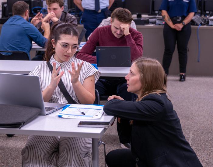 teacher instructing student