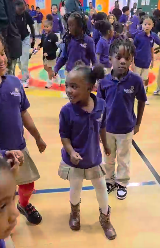 Scholars dance in the gym