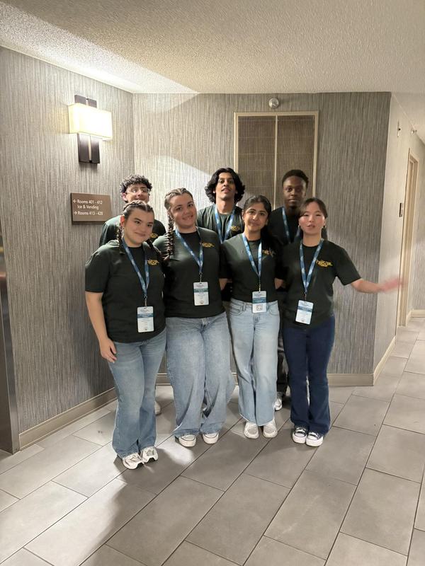 Smiling teens dressed in professional attire