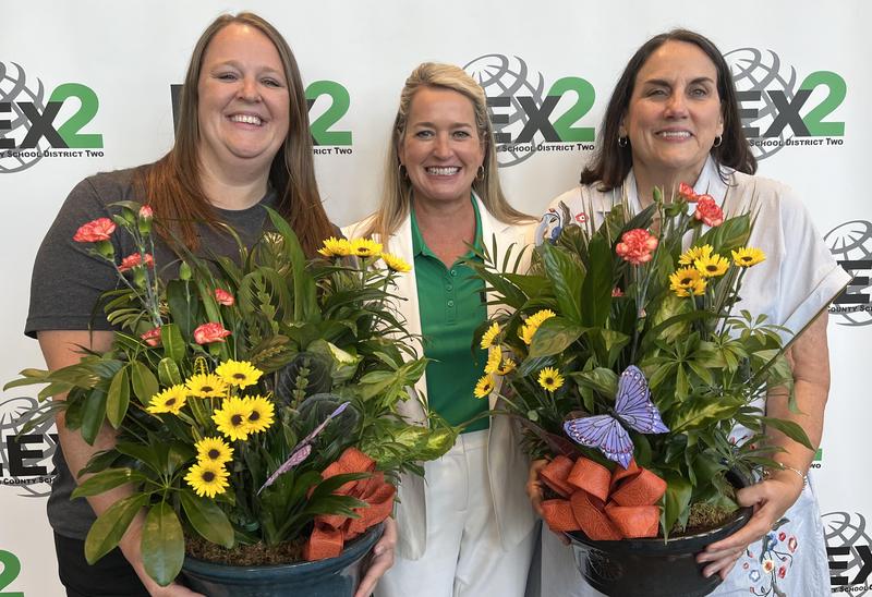Superintendent Brenda Hafner, center, with District Support Staff of the Year Kendra Spires, left, and District Teacher of the Year Kimberly Scalise
