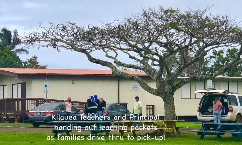 Teachers handing learning packets to students.