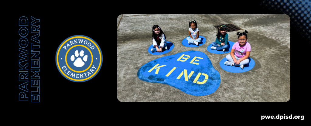 Four children seated on blue circles displaying 'BE KIND' text at Parkwood Elementary.