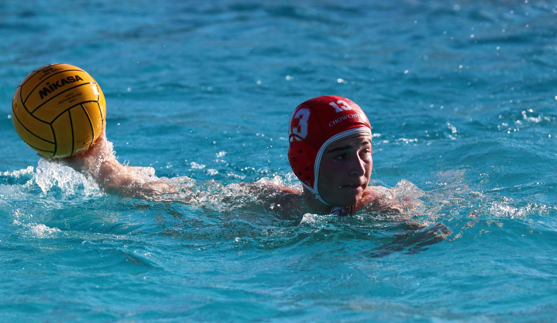 boys water polo players in action against san joaquin memorial