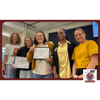 Five women smiling with awards