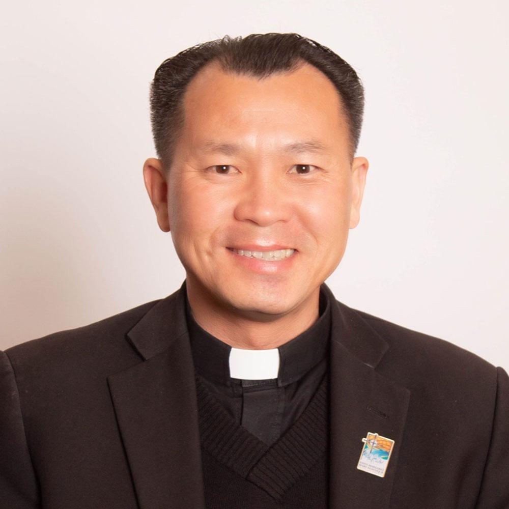 headshot of Fr. Long