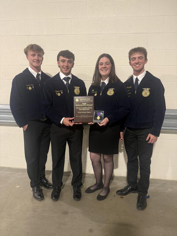 FFA Students smiling for group photo with their award