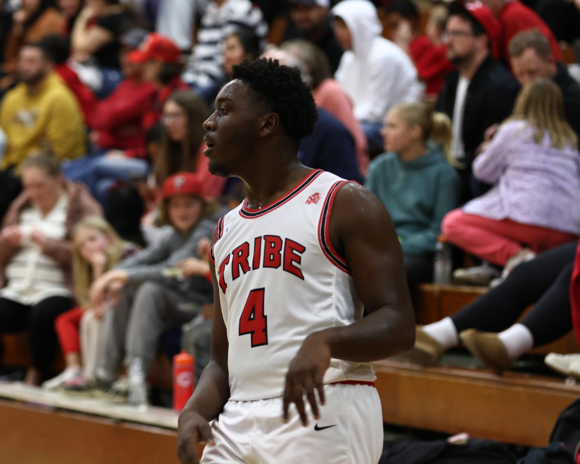 Varsity boys playing basketball against yosemite