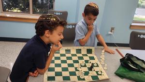 Two boys playing chess