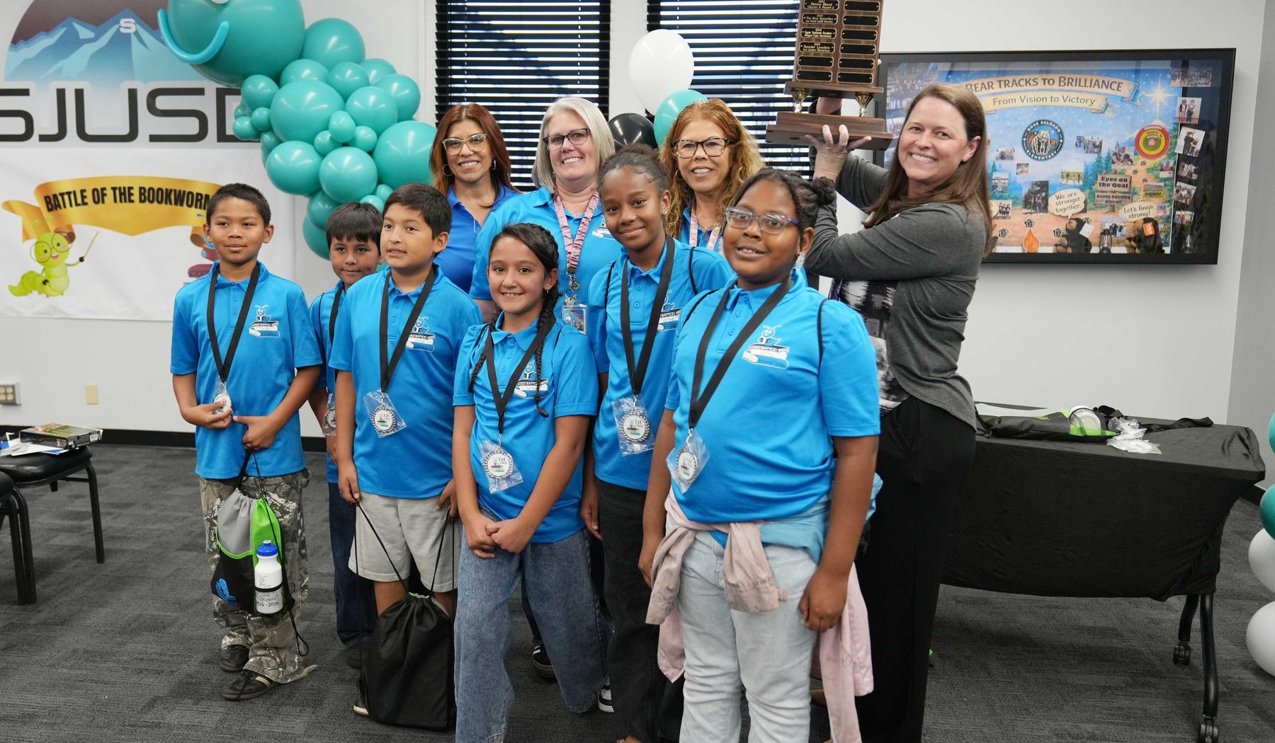 Record Elementary Battle of the Bookworm winning team with trophy