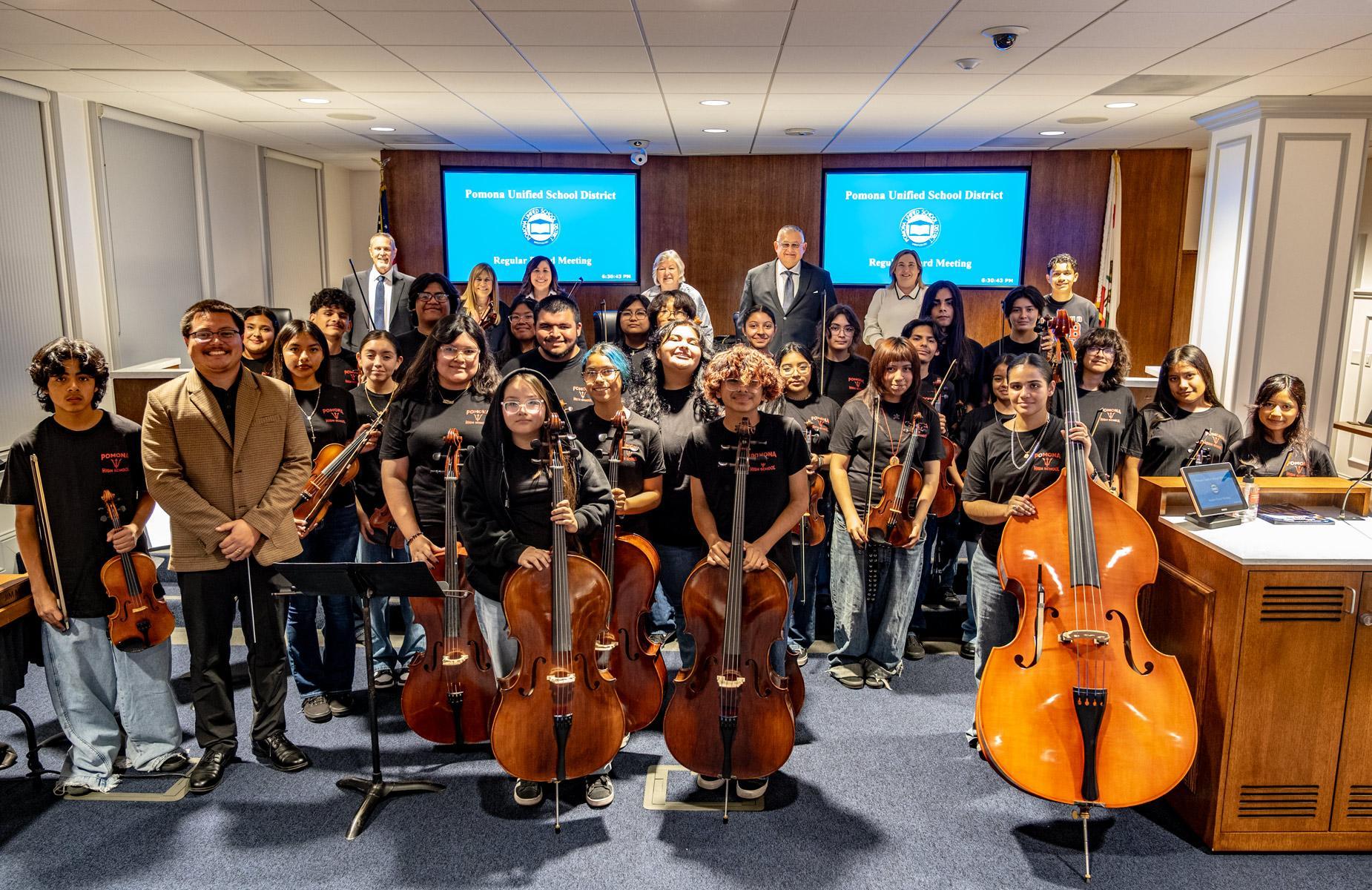 Pomona High School Band group photo about 30 students with board members