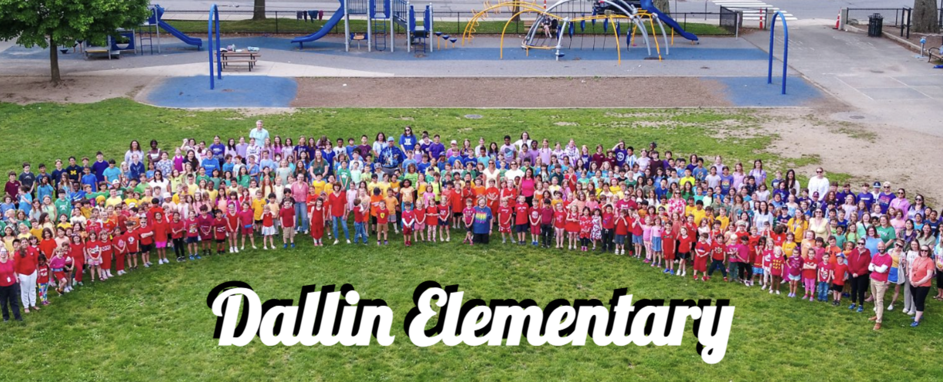 All school photo of all dallin students and staff on the playground.