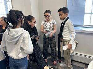 students reading their pamphlets