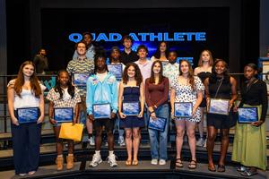 Quad and tri-athletes pose