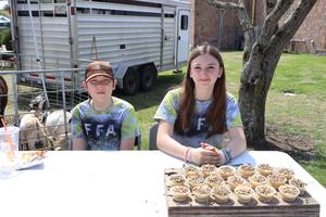 Two students at an FFA table at the Ag Fair