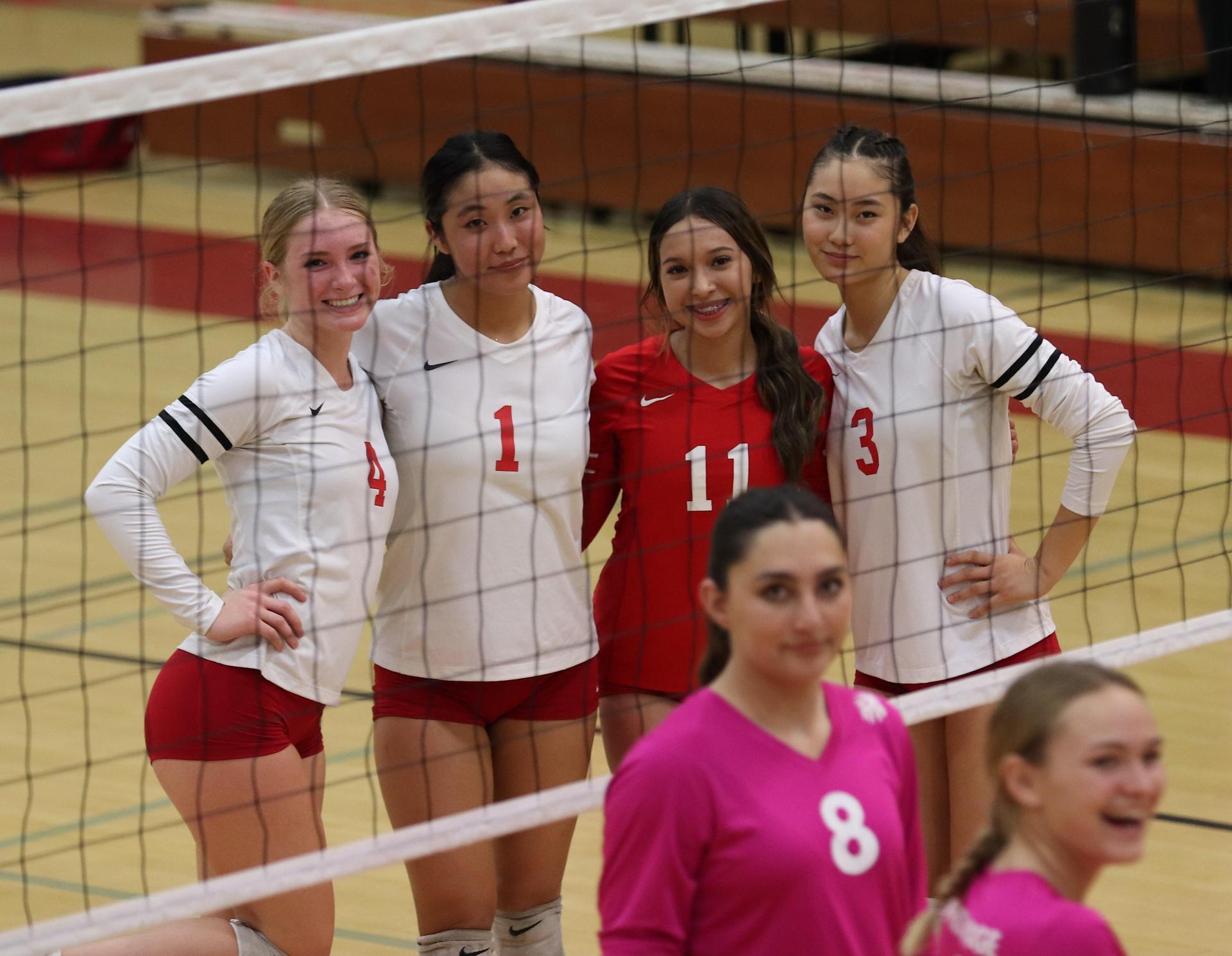 varsity volleyball players in action against Minarets
