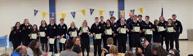 Group of FFA members showing off their Greenhand Degrees.