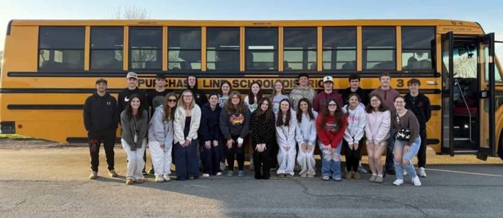 Future Business Leaders of America outside the bus leaving for Hershey state competition.