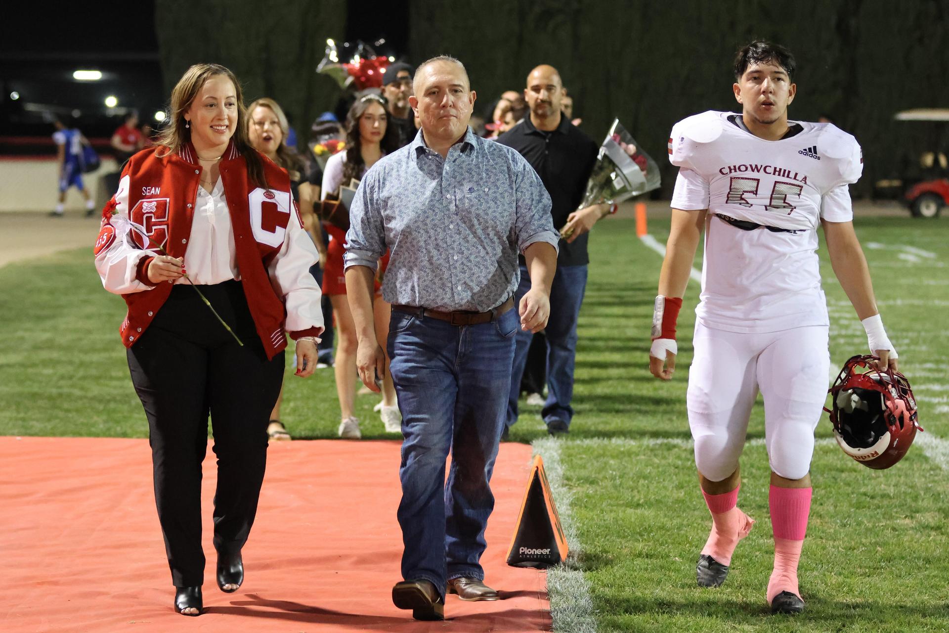 seniors and their escorts celebrating senior night