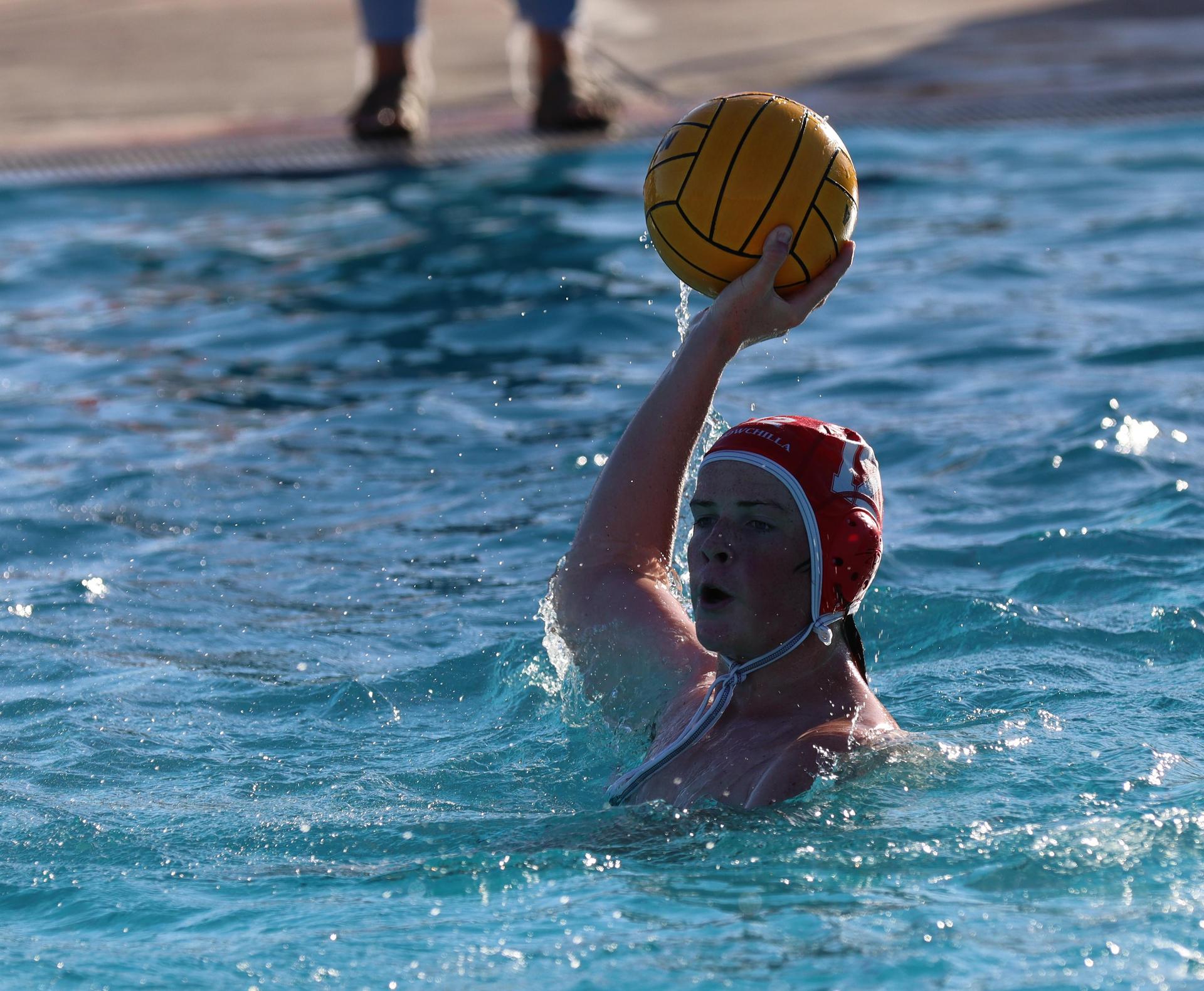 boys water polo players in action against san joaquin memorial