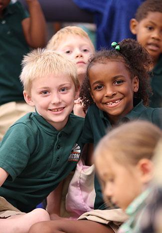 HSA students smiling together in the classroom.